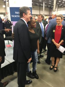 Governor Roy Cooper greets audience members.