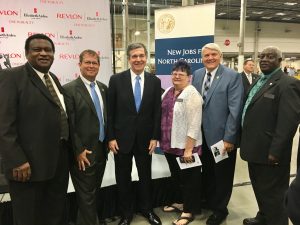 Granville County Commissioners stand with Governor Roy Cooper.
